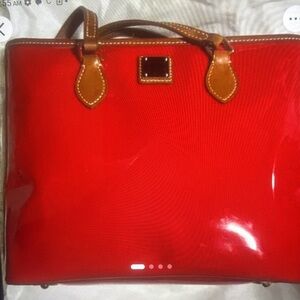 Dooney & Bourke Janie red high gloss patent and tan leather shoulder tote .